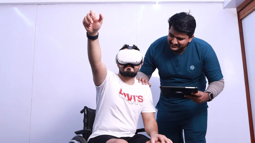 Therapist guiding a patient through Virtual Reality cognitive rehabilitation session at Ayurgreen Hospital